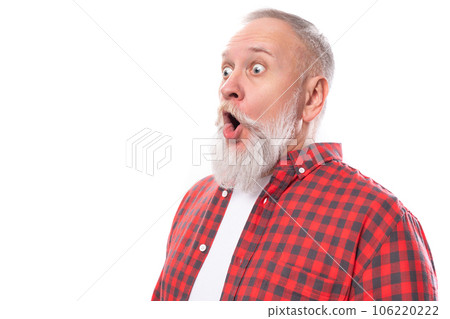 surprised 60 year old gray-haired pensioner man with a beard and mustache in a shirt 106220222