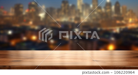 The empty wooden table top with blur background of cityscape. Exuberant. The empty wooden table top with blur background of cityscape. Exuberant. 106220964