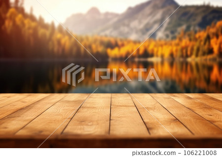 The empty wooden table top with blur background of lake and mountain in autumn. Exuberant. The empty wooden table top with blur background of lake and mountain in autumn. Exuberant. 106221008
