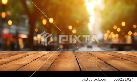 The empty wooden table top with blur background of outdoor cafe at the street. Exuberant. The empty wooden table top with blur background of outdoor cafe at the street. Exuberant. 106221024