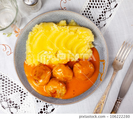Nice tasty meatballs served with mashed potatoes and gravy on side Nice tasty meatballs served with mashed potatoes and gravy on side 106222280