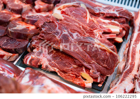 Beef meat laid out in butcher shop window 106222295