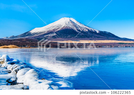 Mt.Fuji in the middle of winter ~Upside down Mt.Fuji reflected in the frozen Lake Yamanaka~ 106222365