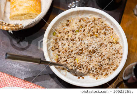 Popular dish of Oriental cuisine is rice with lentils Popular dish of Oriental cuisine is rice with lentils 106222683