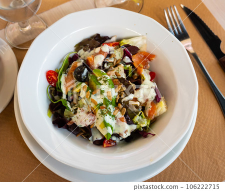 Fresh green lettuce salad with smoked salmon. Fresh green lettuce salad with smoked salmon. 106222715