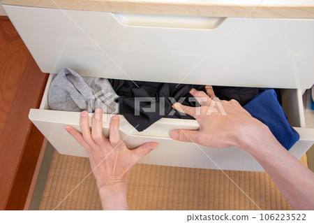 push one's clothes into one's dresser drawer push one's clothes into one's dresser drawer 106223522