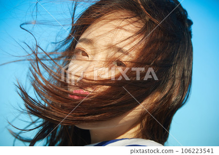 Young woman relaxing outdoors Young woman relaxing outdoors 106223541