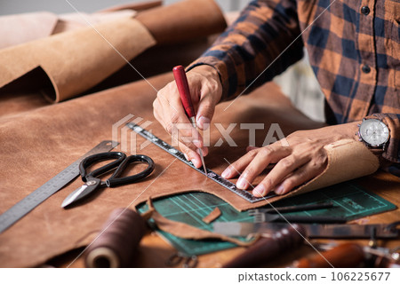 Man working with leather 106225677