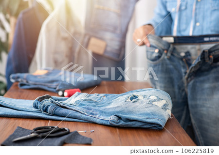 tailor working with jeans. tailor working with jeans. 106225819