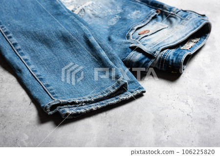 torn on blue jeans 106225820