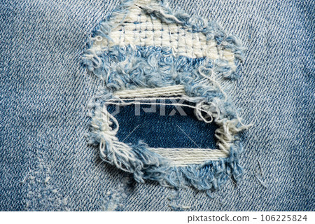 torn on blue jeans 106225824