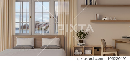 A Scandinavian minimalist bedroom interior with a comfy bed against the window with sheer curtains 106226491