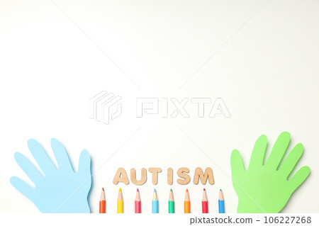 Multicolored paper hands with pencils on white background, place for text. World autism day concept Multicolored paper hands with pencils on white background, place for text. World autism day concept 106227268