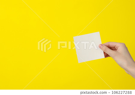 White blank paper in female hands, place for text White blank paper in female hands, place for text 106227288