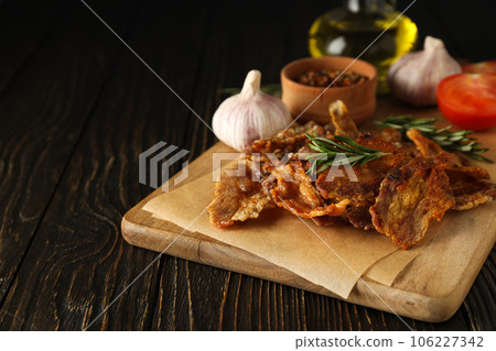 Tasty breakfast and delicious meat food concept - fried bacon Tasty breakfast and delicious meat food concept - fried bacon 106227342