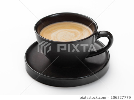 Cup and saucer with black fresh hot creamy coffee drink on white. 106227779