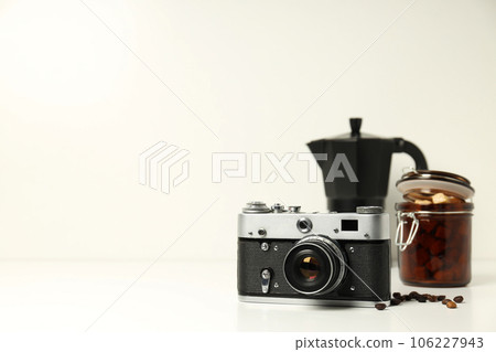 Vintage camera, jar of sugar and coffee maker on white background, space for text 106227943