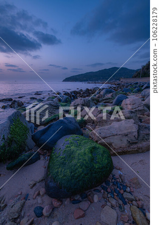 Coastal rocks and sunset view 106228179