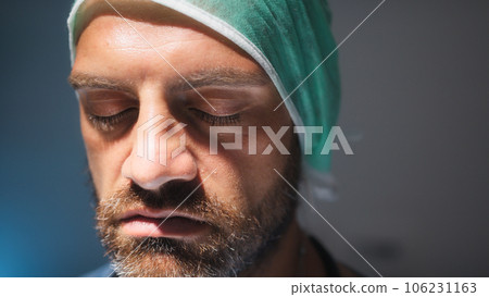 Burnout Tired doctor open eye after a long surgery work Burnout Tired doctor open eye after a long surgery work 106231163