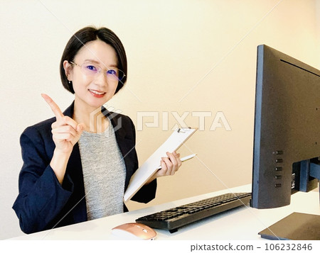 A woman in a suit explaining at home work A woman in a suit explaining at home work 106232846