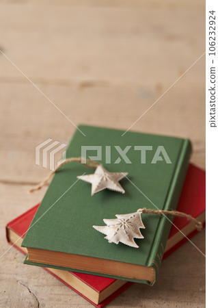 Christmas image Ornaments placed on old books 106232924
