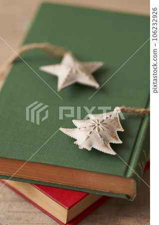 Christmas image Ornaments placed on old books 106232926