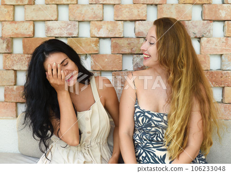 Russian beautiful blonde woman talking with her best friend 106233048