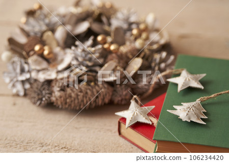 Christmas image Ornaments and Christmas wreath placed on old books 106234420