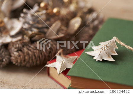 Christmas image Ornaments and Christmas wreath placed on old books Christmas image Ornaments and Christmas wreath placed on old books 106234432