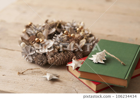 Christmas image Ornaments and Christmas wreath placed on old books 106234434