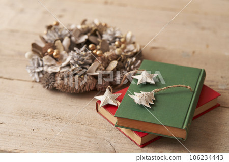 Christmas image Ornaments and Christmas wreath placed on old books 106234443