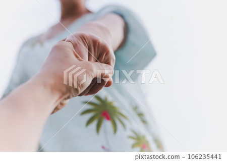 Help concept hands reaching out to help each other. 106235441