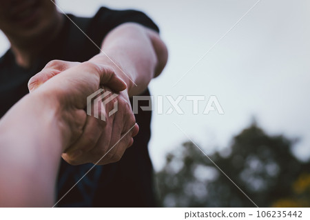 Help concept hands reaching out to help each other. 106235442
