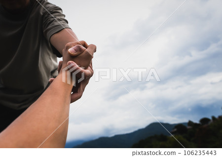 Help concept hands reaching out to help each other. 106235443