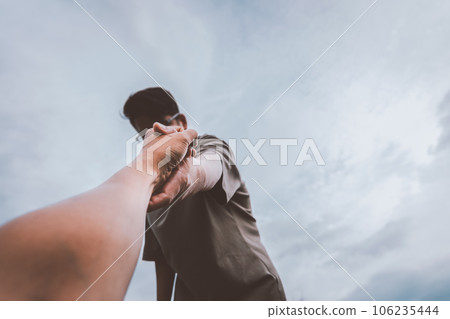 Help concept hands reaching out to help each other. 106235444