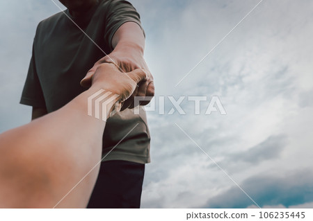 Help concept hands reaching out to help each other. 106235445