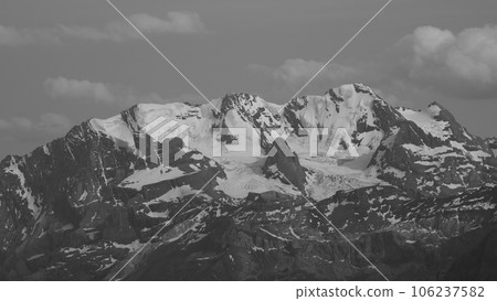 Monochrome image of the Bluemlisalp Range and glacier, Switzerland. Monochrome image of the Bluemlisalp Range and glacier, Switzerland. 106237582