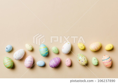 Happy Easter concept. Preparation for holiday. Easter eggs on colored background. flat lay top view copy space banner 106237890