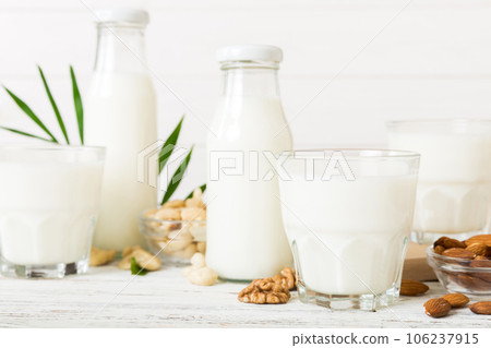 Set or collection of various vegan milk almond, cashew, on table background. Vegan plant based milk and ingredients, top view Set or collection of various vegan milk almond, cashew, on table background. Vegan plant based milk and ingredients, top view 106237915