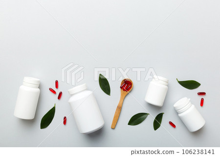 different drugs and health supplement pills with medicine bottle health care and medical top view. Vitamin tablets. Bottle with colored pills on table background. Multivitamins different drugs and health supplement pills with medicine bottle health care and medical top view. Vitamin tablets. Bottle with colored pills on table background. Multivitamins 106238141
