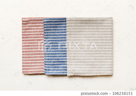 top view with gray kitchen napkin isolated on table background. Folded cloth for mockup with copy space, Flat lay. Minimal style 106238151