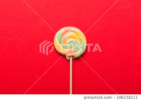 Colorful candies, lollypop on the colorful background, multicolored minimal style top view Colorful candies, lollypop on the colorful background, multicolored minimal style top view 106238211