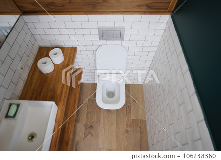 Toilet bowl stall in modern bathroom interior closeup 106238360