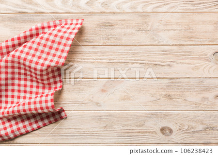 top view with red empty kitchen napkin isolated on table background. Folded cloth for mockup with copy space, Flat lay. Minimal style top view with red empty kitchen napkin isolated on table background. Folded cloth for mockup with copy space, Flat lay. Minimal style 106238423