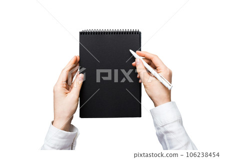 Woman hand with pencil writing on notebook. Woman working on office table. Female hand holding pencil and sketchbook. Mock-up Concept Woman hand with pencil writing on notebook. Woman working on office table. Female hand holding pencil and sketchbook. Mock-up Concept 106238454