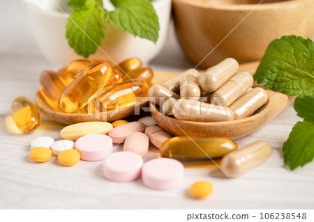 Alternative medicine herbal organic capsule with vitamin E omega 3 fish oil, mineral, drug with herbs leaf natural supplements for healthy good life. 106238548