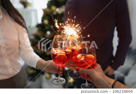 People greet the new year, cocktails with sparklers at a part 106238609