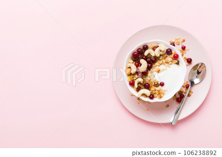 Healthy breakfast food with granola, yogurt, fruits and nuts. Dessert parfait with dried fruits for breakfast Healthy breakfast food with granola, yogurt, fruits and nuts. Dessert parfait with dried fruits for breakfast 106238892