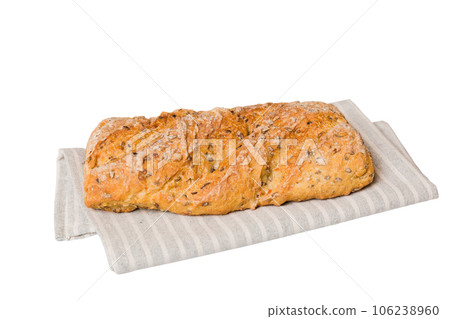 Freshly baked delicious french bread with napkin isolated on white background top view. Healthy white bread loaf 106238960