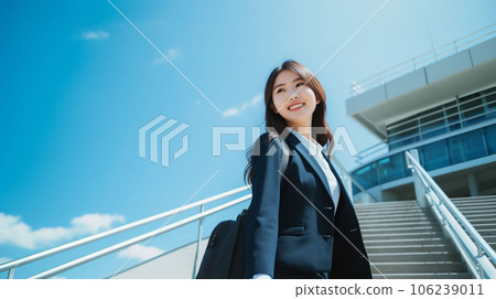 Smiling woman wearing a recruit suit under the blue sky AI image Smiling woman wearing a recruit suit under the blue sky AI image 106239011